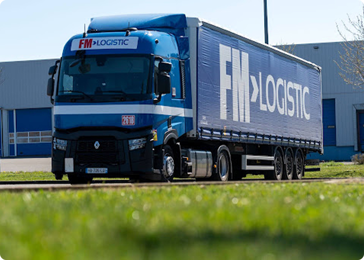 FM Logistic truck leaving a warehouse illustrating the article regarding the transport partner satisfaction.